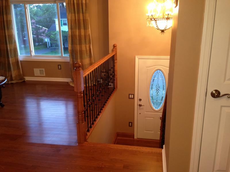 FX Home Renovation, new stair railing and harwood flooring